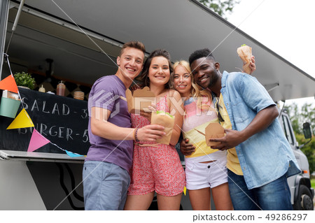 happy friends with wok and burger at food truck 49286297