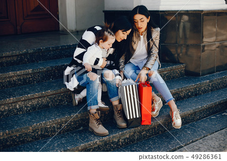 Family in a summer city Family in a summer city 49286361