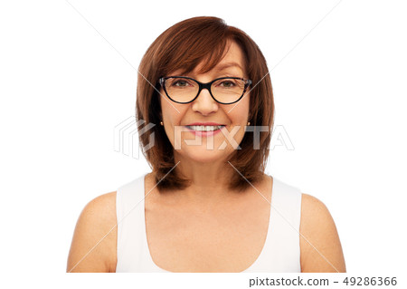 portrait of senior woman in glasses over white portrait of senior woman in glasses over white 49286366