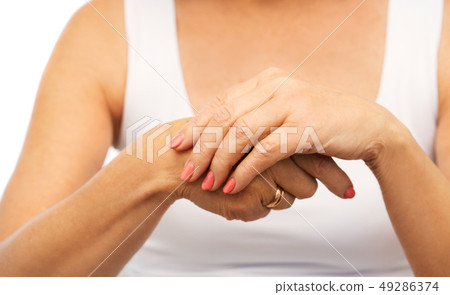 close up of senior woman hands with manicure close up of senior woman hands with manicure 49286374