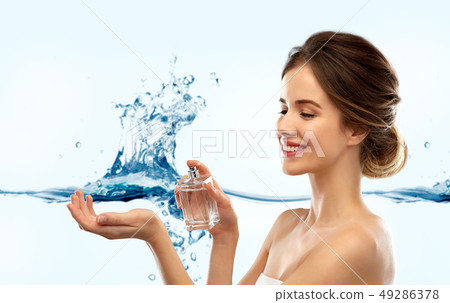 happy woman with perfume over water splash happy woman with perfume over water splash 49286378