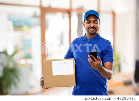 indian delivery man with smartphone and parcel box indian delivery man with smartphone and parcel box 49286413