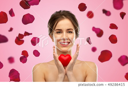 beautiful smiling woman holding red heart beautiful smiling woman holding red heart 49286415