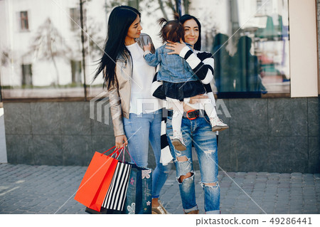 Family in a summer city Family in a summer city 49286441