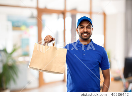 delivery man with food in paper bag at office 49286442