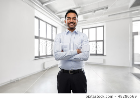 indian businessman or realtor in empty office room indian businessman or realtor in empty office room 49286569