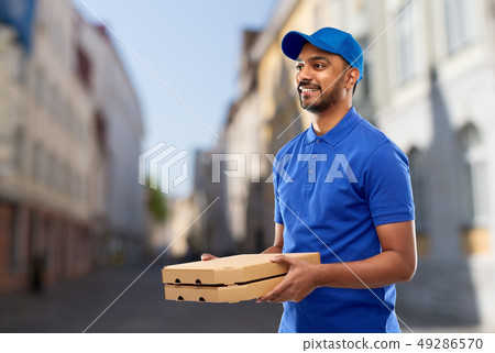 happy indian delivery man with pizza boxes in city happy indian delivery man with pizza boxes in city 49286570