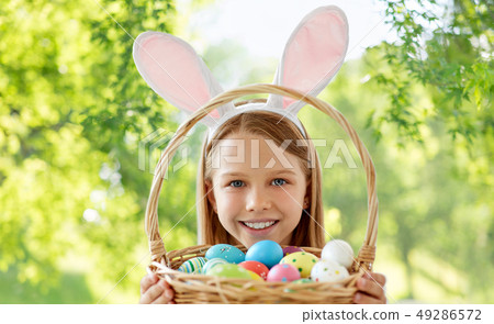 happy girl with colored easter eggs 49286572