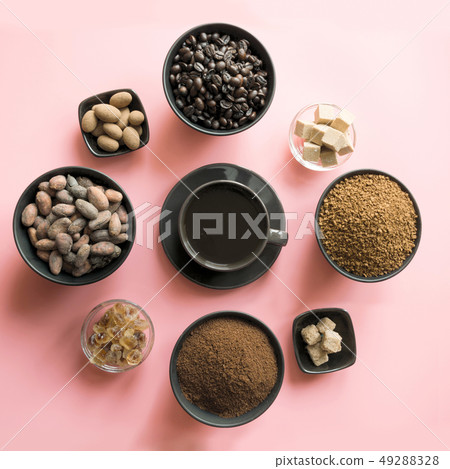Concept of coffee, cacao beans and sugar on pink. Concept of coffee, cacao beans and sugar on pink. 49288328