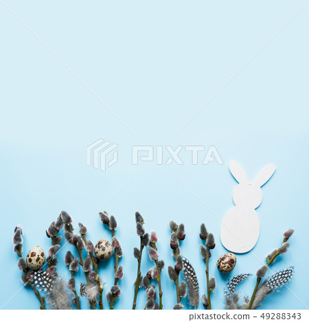 Easter creative frame of willow branch on blue 49288343