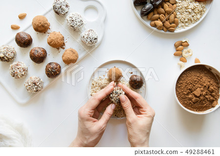 Energy balls with cacao and nuts on white. 49288461
