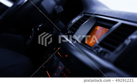 Buttons of radio, dashboard, climate control in car close up Buttons of radio, dashboard, climate control in car close up 49291221