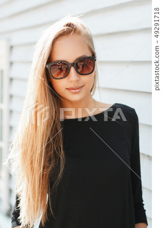 Stylish beautiful woman in sunglasses near 49291718