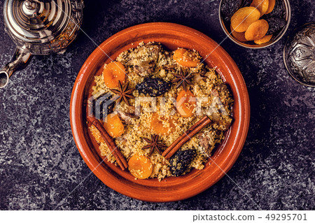 Traditional moroccan tajine of chicken with dried 49295701