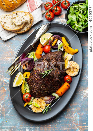 Club Beef steak with pepper sauce and Grilled vegetables on dark wooden background. Roas beef. Copy 49295774