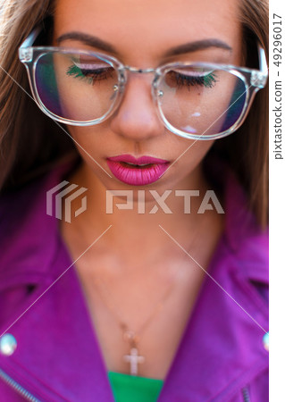 Female face with glasses closeup 49296017