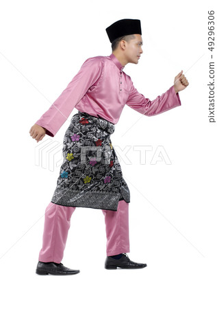 man with traditional clothing during hari raya man with traditional clothing during hari raya 49296306