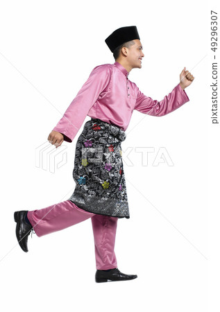 man with traditional clothing during hari raya man with traditional clothing during hari raya 49296307