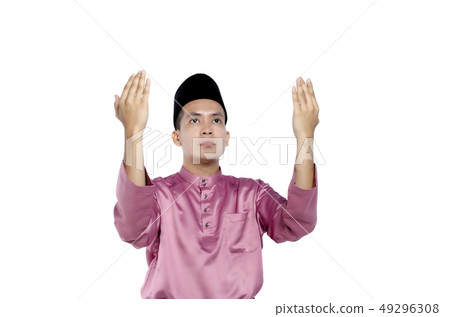 man with traditional clothing rising hand for pray 49296308