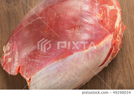 Raw fresh beef on a wooden background, catalog. Raw fresh beef on a wooden background, catalog. 49298034