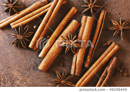 Mix of various spices on the textured brown table Mix of various spices on the textured brown table 49298449