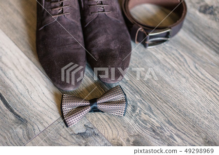 Accessories of the groom shoes, belt, cufflinks 49298969