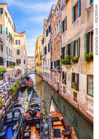 Narrow beautiful street with parked gondolas, 49299544