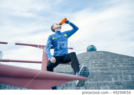 Man on city background at morning. Healthy lifestyle concept. Man on city background at morning. Healthy lifestyle concept. 49299656
