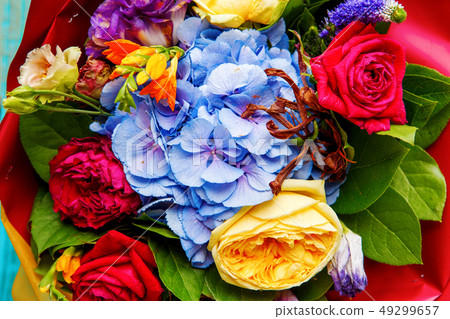Close-up photo ofp bouquet of multi-colored roses. Close-up photo ofp bouquet of multi-colored roses. 49299657