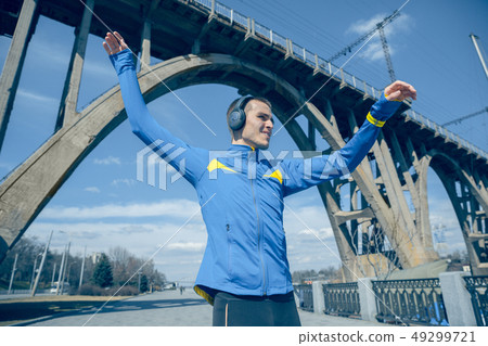 Man running on city background at morning Man running on city background at morning 49299721