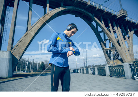 Man on city background at morning. Healthy lifestyle concept. Man on city background at morning. Healthy lifestyle concept. 49299727