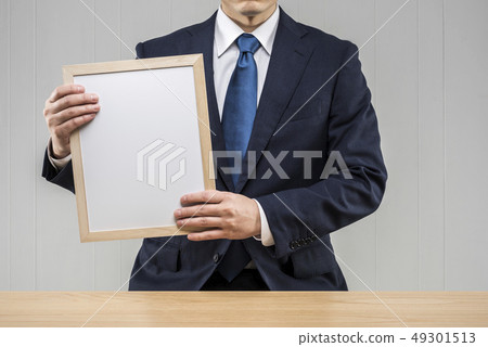 Men holding a board 49301513