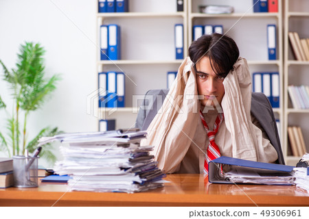 Crazy young man in straitjacket at the office  49306961