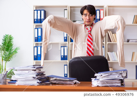 Crazy young man in straitjacket at the office  49306976