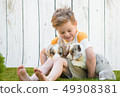 Little boy and corgi puppies 49308381