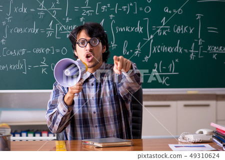 Funny male math teacher in the classroom  49310624