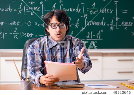 Funny male math teacher in the classroom Funny male math teacher in the classroom 49310646