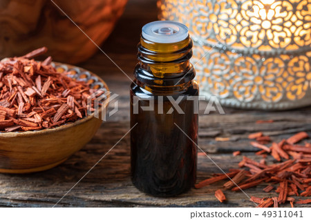 A bottle of sandalwood essential oil  49311041