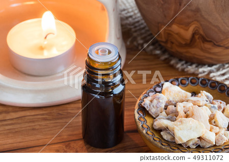 A bottle of styrax benzoin essential oil  49311072