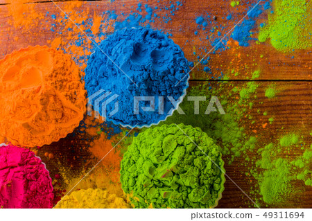 top view of colorful traditional holi powder in bowls on wood 49311694