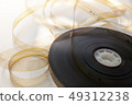 8 mm film reel on white background 49312238