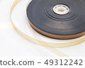 8 mm film reel on white background 49312242