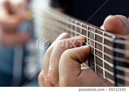 fingers playing guitar 49312595