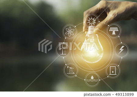 Hand of male holding a light bulb and copy space Hand of male holding a light bulb and copy space 49313899