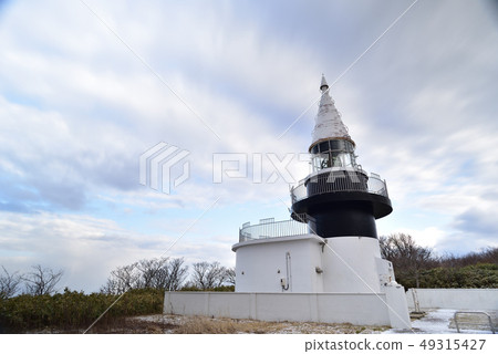 Taking a picture of the early spring scenery of the Motsu Tadasu lighthouse, Japan's highest sea level in Hokkaido Setana 49315427