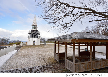 Taking a picture of the early spring scenery of the Motsu Tadasu lighthouse, Japan's highest sea level in Hokkaido Setana Taking a picture of the early spring scenery of the Motsu Tadasu lighthouse, Japan's highest sea level in Hokkaido Setana 49315433