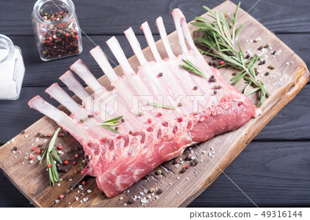 Raw rack of lamb with spices and herbs 49316144