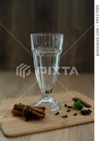 Empty glass on a wooden platform with ingredients 49317005