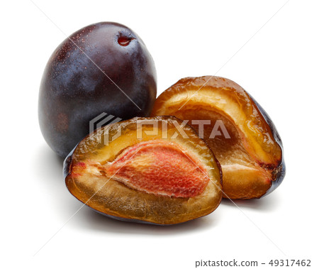 Whole and half Damson plums isolated on white Whole and half Damson plums isolated on white 49317462