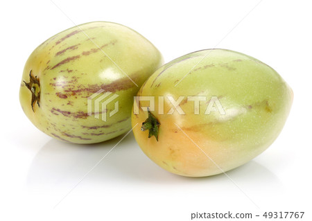 Whole Pepino melon fruits isolated on white Whole Pepino melon fruits isolated on white 49317767